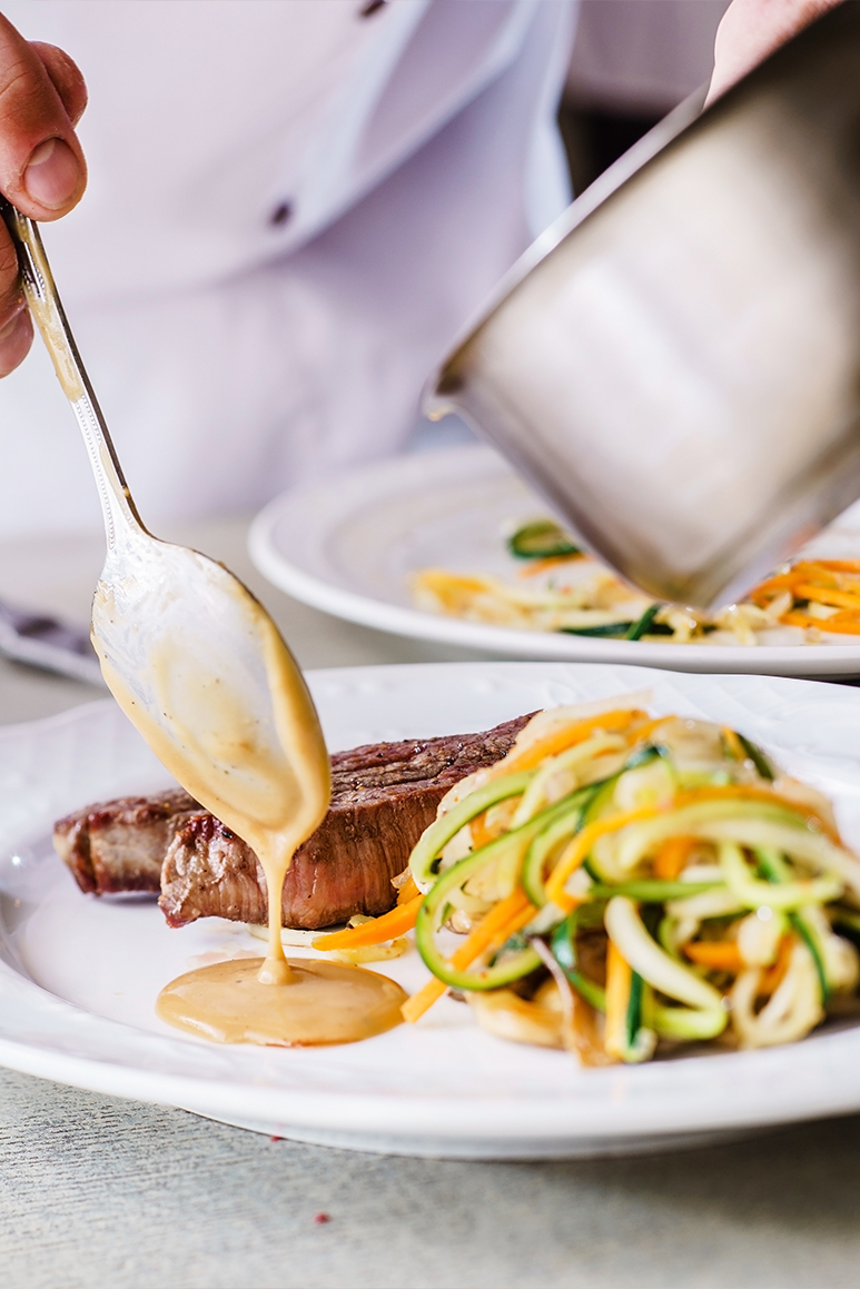 Kids learning how to cook in a cooking class.