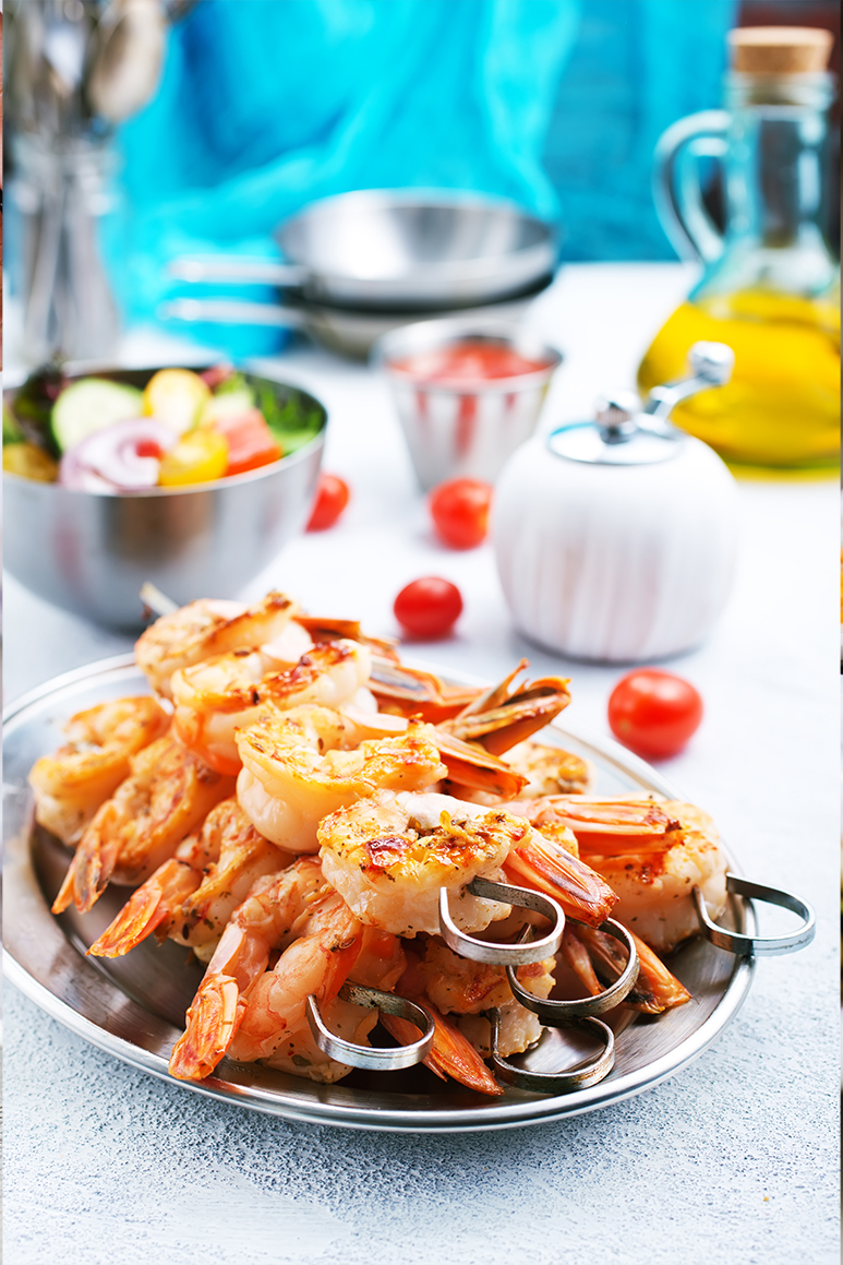 Kids learning how to cook in a cooking class.